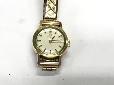A vintage ladies omega watch with paperwork.