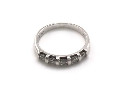 A 9ct white gold ring set with five diamonds. 
Size N and 2.57g