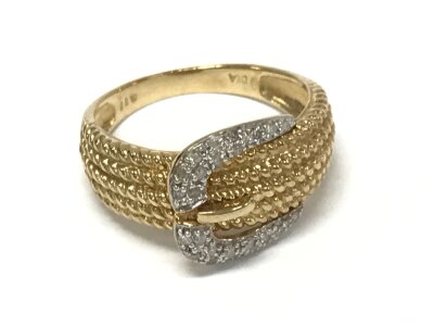A 9ct gold buckle ring , diamond set, size P, 3.5g