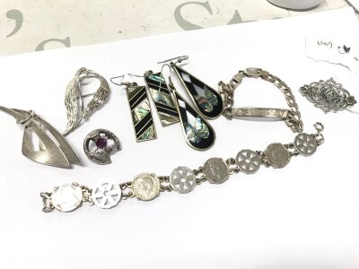 A collection of silver jewellery including earrings, brooches, bracelets. 73g