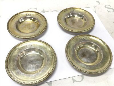 Four Georgian silver side dishes. Marked London possibly 1804. 11cm wide.