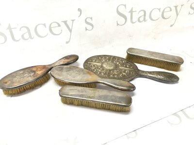 A Collection of silver brushes and a mirror