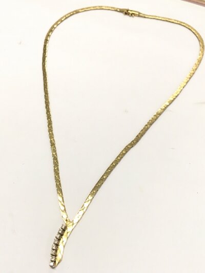 A 14K Yellow gold and diamond flat design necklace, 16g total weight