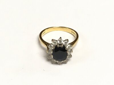 An 18ct gold, sapphire and diamond ring, approx 3.8g and approx size J.