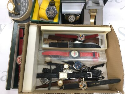 A collection of watches and watch parts.