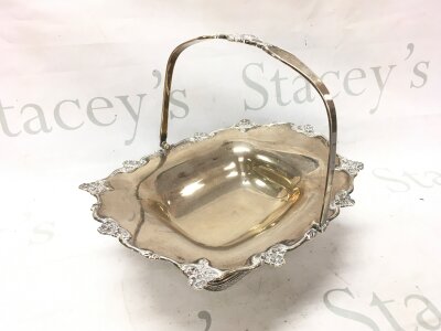 A silver hallmarked basket with a loop handle. Sheffield 1918. 28cm wide, 10cm tall, 23cm tall with handle. 745g total weight