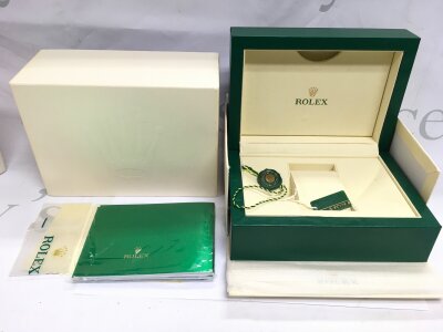 A Rolex watch box, booklet etc.