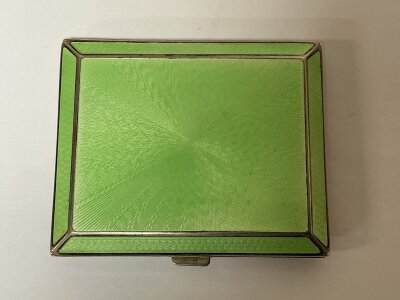 A guilloche enamel cigarette case, stamped gold cased.