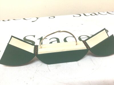 An 18carat gold yellow and white gold bangle set with a Marquise cut diamond approximately 0.30ct Colour G Clarity VS1. Weight 16g