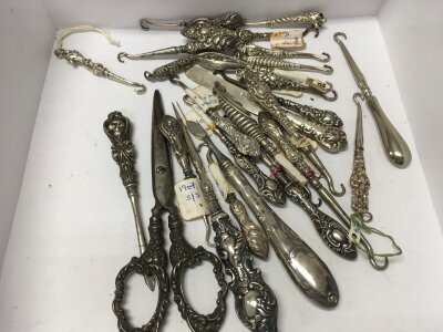 A collection of silver button hooks,180g approximately