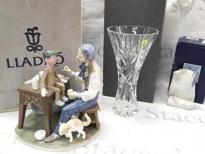 A boxed Lladro figure group The Puppet Painter , boxed Lladró Society "Art Brings Us Together" porcelain plaque, boxed Waterford crystal vase