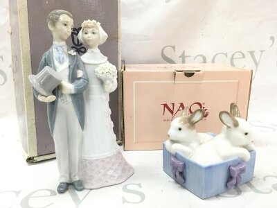 A boxed Lladro bride and groom porcelain figure group and a boxed Nao basket of rabbits porcelain figure group . 9 and 18cm tall