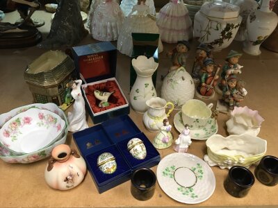 A collection of ceramics including Halcyon Days enamel patch boxes, Hummel figures, Belleek vase, cup and saucer, Royal Worcester boxed Gold Crest etc
