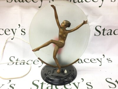 An Art Deco side lamp nude dancer standing on one leg. Approximately 39cm tall.