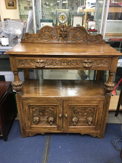 A carved oak side board 105cm wide 130cm tall 47cm long- NO RESERVE