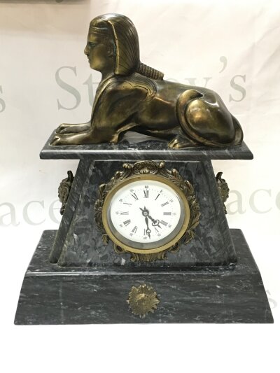 A black slate Egyptian influence clock. 32cm wide 36cm tall