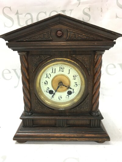 A small wooden mantle clock , H.A.C 8 day made in Württemberg. 22cm wide 26cm tall 14cm deep