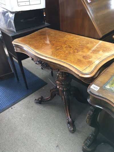 A Victorian walnut card table. Dimensions 75cm tall, 46cm long, 90cm wide The top 90x92cm