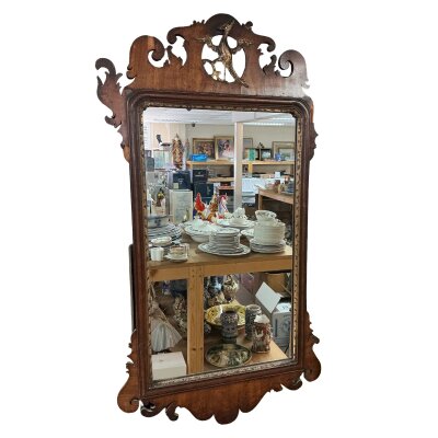 A Georgian wall mirror with gilt eagle decoration. 92cm x 47cm, in need of restoration.