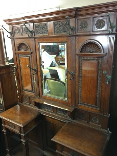A quality carved late Victorian walnut stick stand. 138cm wide, 205cm tall, 40cm long