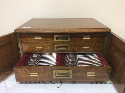 A quality oak canteen cutlery box fitted with three drawers containing an incomplete set of silver plated cutlery
