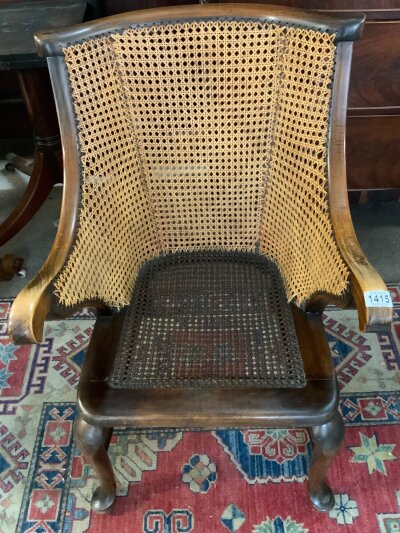 A vintage 1920s Bergere arm chair.
