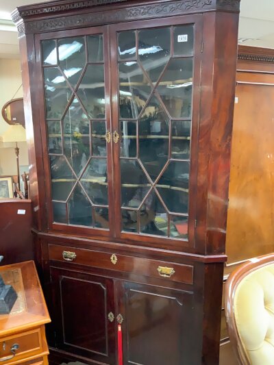 A Large 2 part Georgian corner unit, the top section glazed with fretwork decoration.