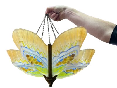 A 1930s geometric light shade with moulded-pressed glass panels,
