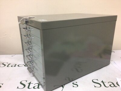 A metal coin collectors cabinet with seven drawers each with a detachable soft pad with key height 30cm depth 46cm