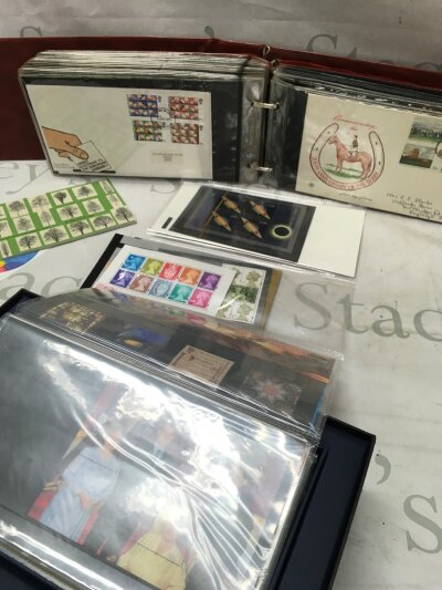 A Collection of Elizabeth II presentation packs in albums with some first day covers and a boxed 2000 millennium set
