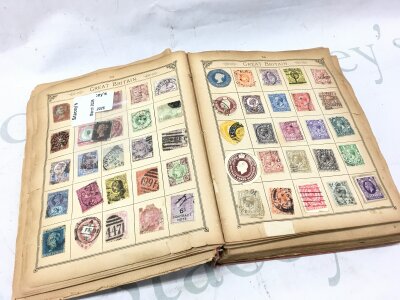 An interesting collection of 19th and 20th century world stamps displayed in an album , including a penny black