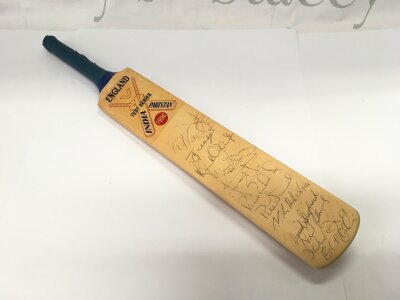 A multi signed miniature cricket bat from the England, India and Pakistan 1996 test series.