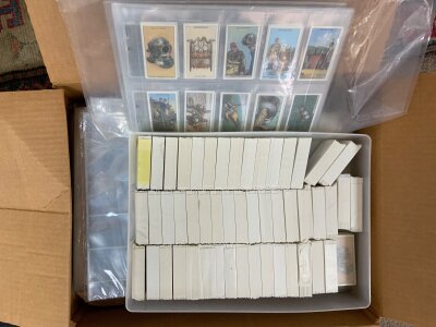 A mixed collection of reproduction cigarette card sets.