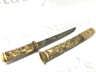 A bone Meiji period carved dagger. Blade 20cm long, total length