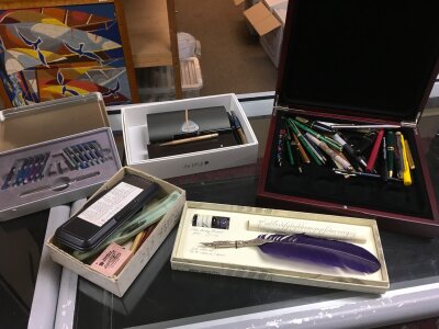 A large collection of pens and pen equipment