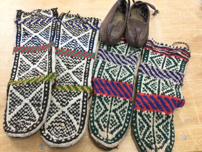 A pair Tibetan woollen boots with Leather soles and a pair of Turkish leather shoes.