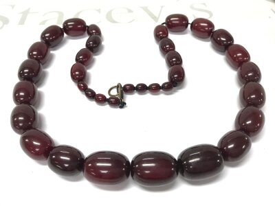 A cherry red amber or Bakelite style necklace , 85cm 170g
