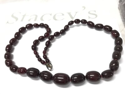 A cherry red amber or Bakelite style necklace 92cm. 131g