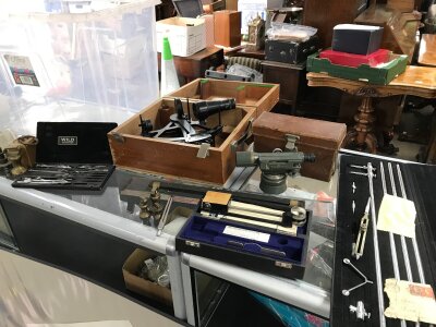 A Collection of instruments some boxed including a Kelvin Hughes sextant, vintage scales, Microptic Theodolite no 2 by Hilger & Watts and three wooden tripods