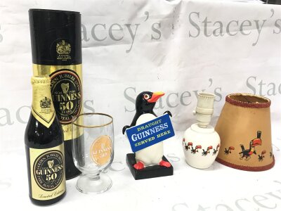 A Collection of vintage Guinness Collectables including a Golden Jubilee bottle, rubber penguin figure by Charles E Tresise and a ceramic toucan lamp