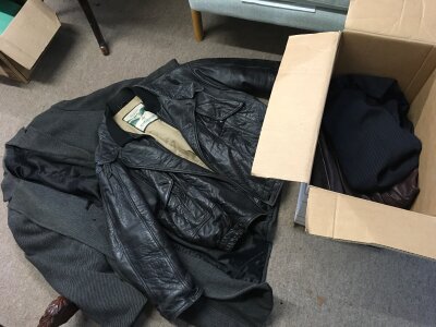 A Collection of vintage clothes including three leather jackets
