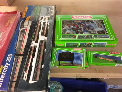 A boxed Subbuteo soccer set and two boxed railway sets comprising Hornby and Triang examples.