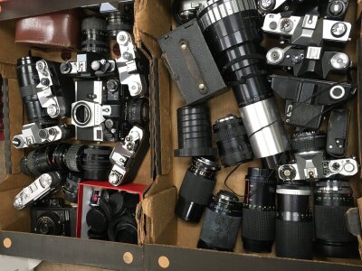 Two boxes of vintage cameras and lenses including an Isco Gottingen anamorphotic kiptar, Praktica MTL3, Coronet flash master, Zenit-8, Yashica FR2, Canon AV1
