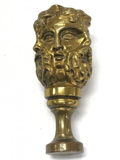 A bronze multi face design table seal, 8cm tall