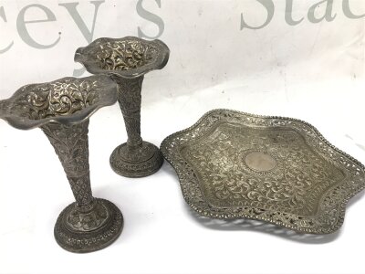 A Indian white metal dish (18cm wide) and flutes (11cm tall)