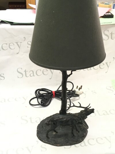 A bronze stag lamp base. Figure 17cm tall, lamp 63cm tall approximately