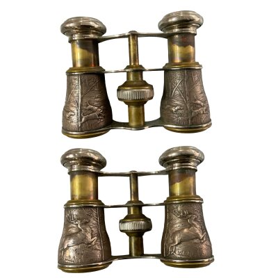 A small pair of vintage opera glasses, unmarked with white metal pressed hunting scenes.