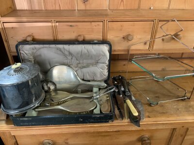 A collection of silver plated items to include a silver plated biscuit barrel, cake stand, 6pc dressing table set, mixed silver and silver plated cutlery.