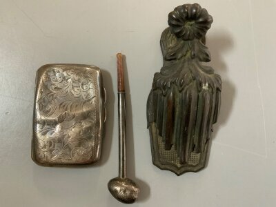 A Small hallmarked silver case (worn), hammered silver pipe, Victorian brass desk paper clip.