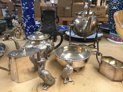 A good collection of silver plated ware including tea set serving trays and candelabra.